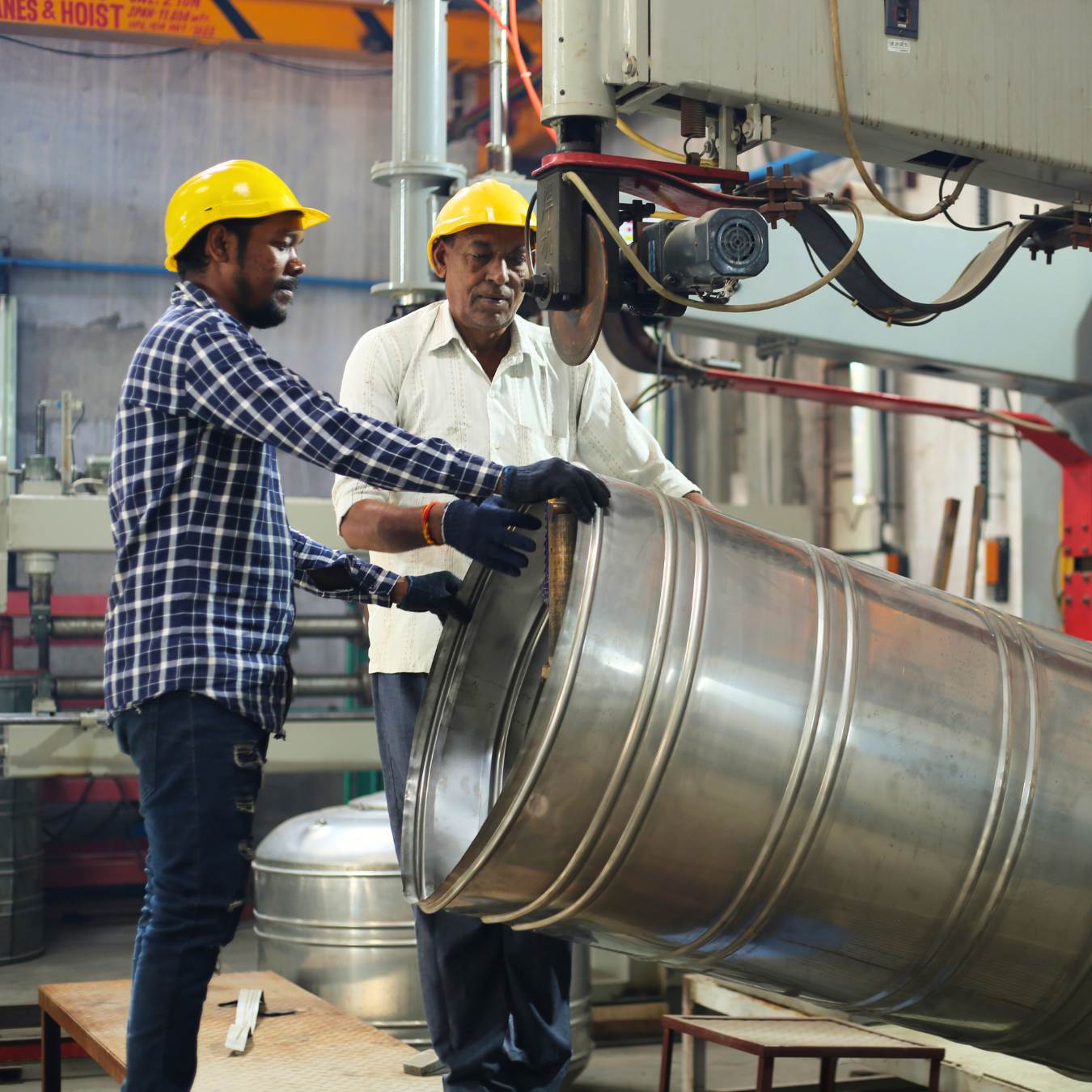 About Us Workers assembling a stainless steel water tank body at Wonderpure factory