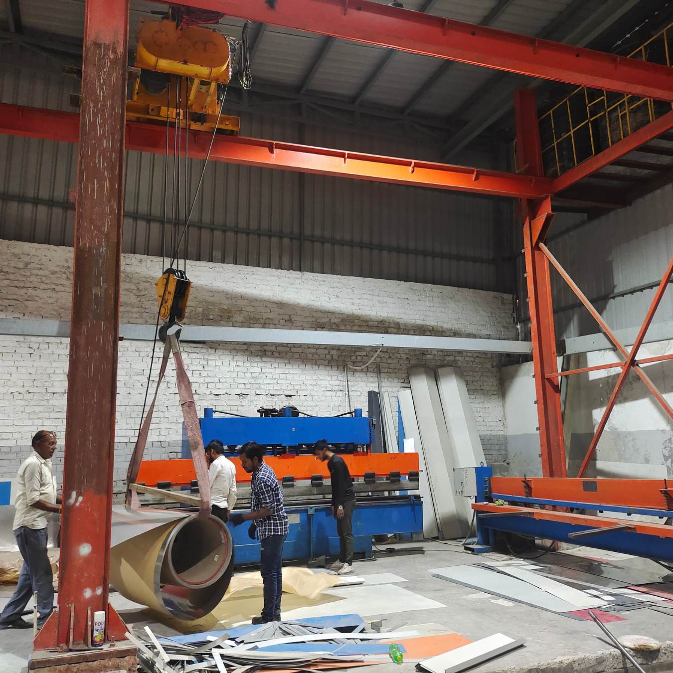 About Us Wonderpure factory floor with crane and sheet-bending machinery for tank manufacturing
